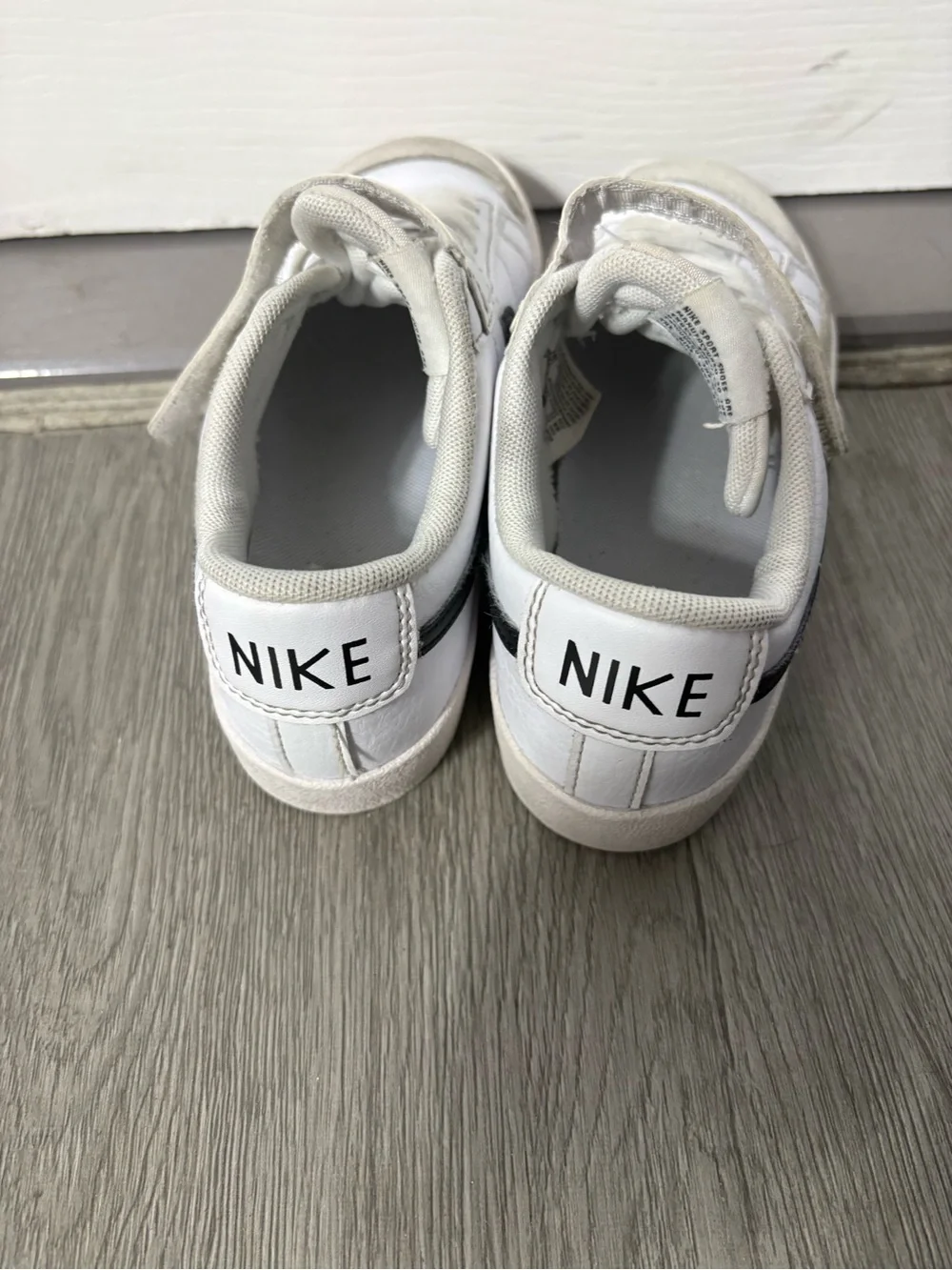 Nike Kids White Sneakers with Black Swoosh